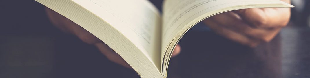 Person flipping through book pages